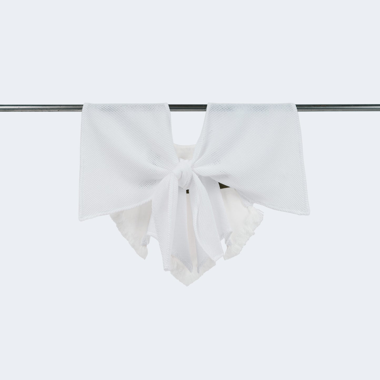 Tied collar showcasing olive canvas, white denim, and mesh blend