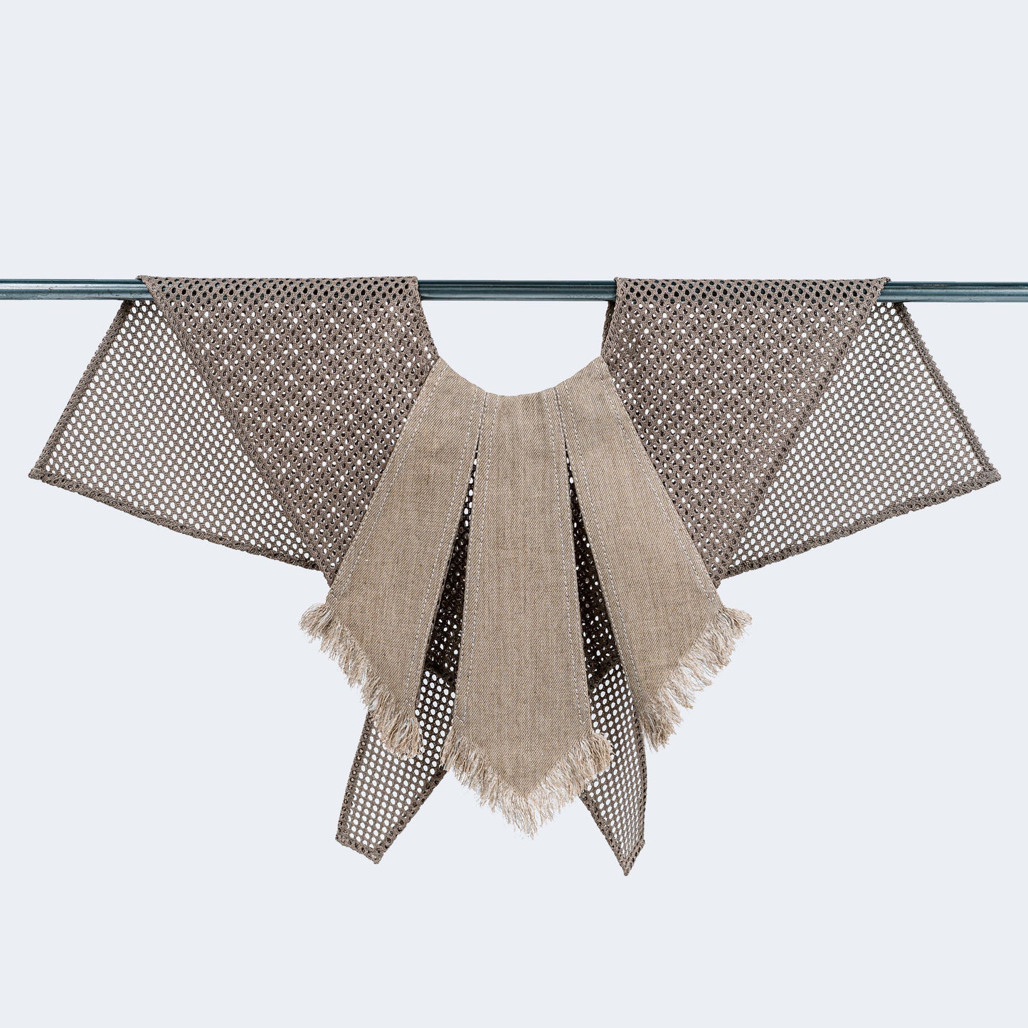 Front view of sand-colored canvas and mesh collar on hanger