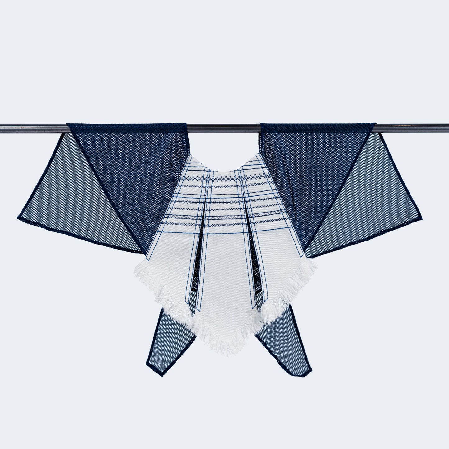 Front view of embroidered white denim and blue mesh collar on hanger