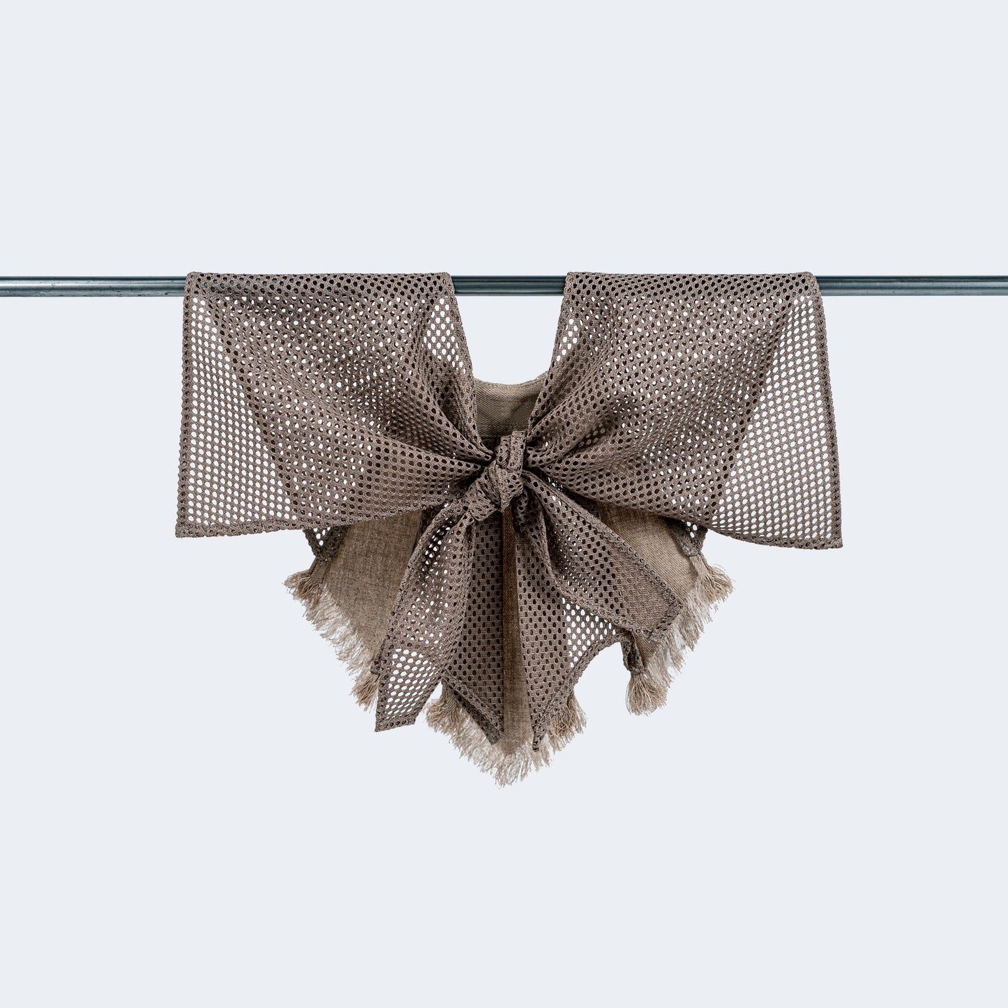 Collar tied on hanger showcasing texture contrast