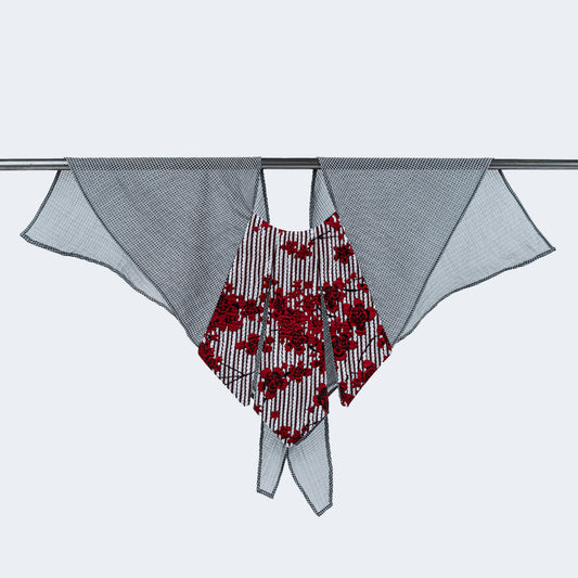 Front view of floral print collar with sheer gray mesh, displayed on hanger