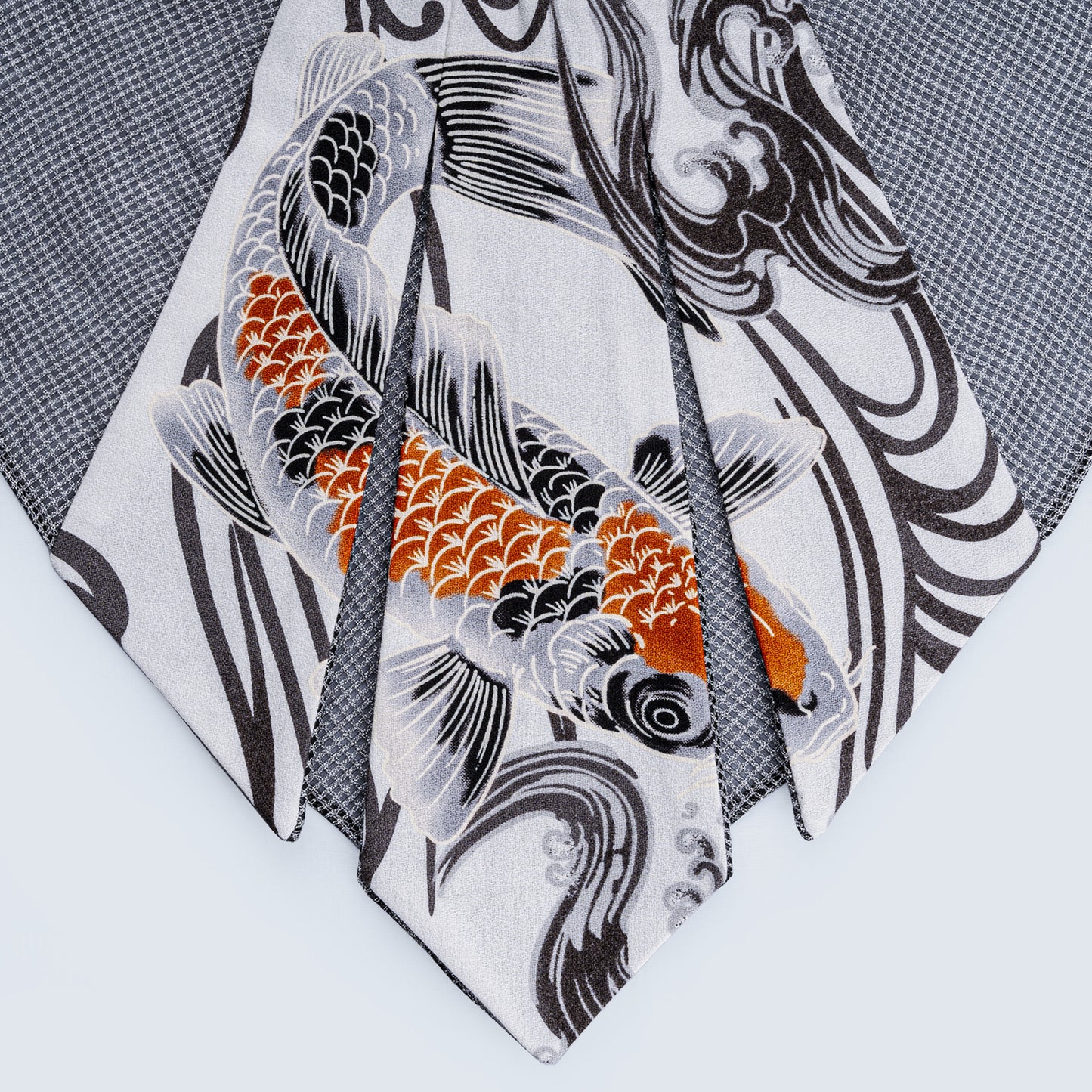 Close-up of limited edition Japanese fish print collar with sheer gray fabric showing carefully connected print