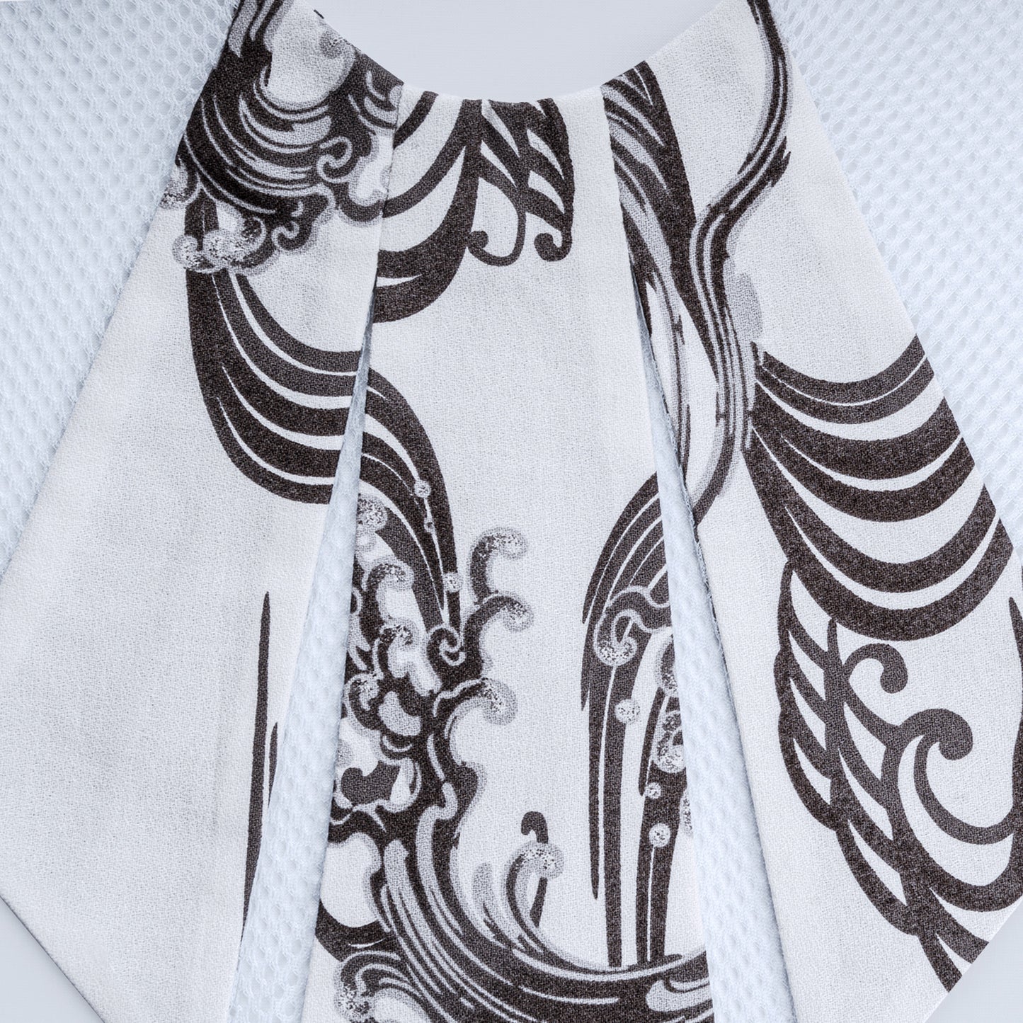 Close-up of Japanese print collar with sheer white mesh fabric