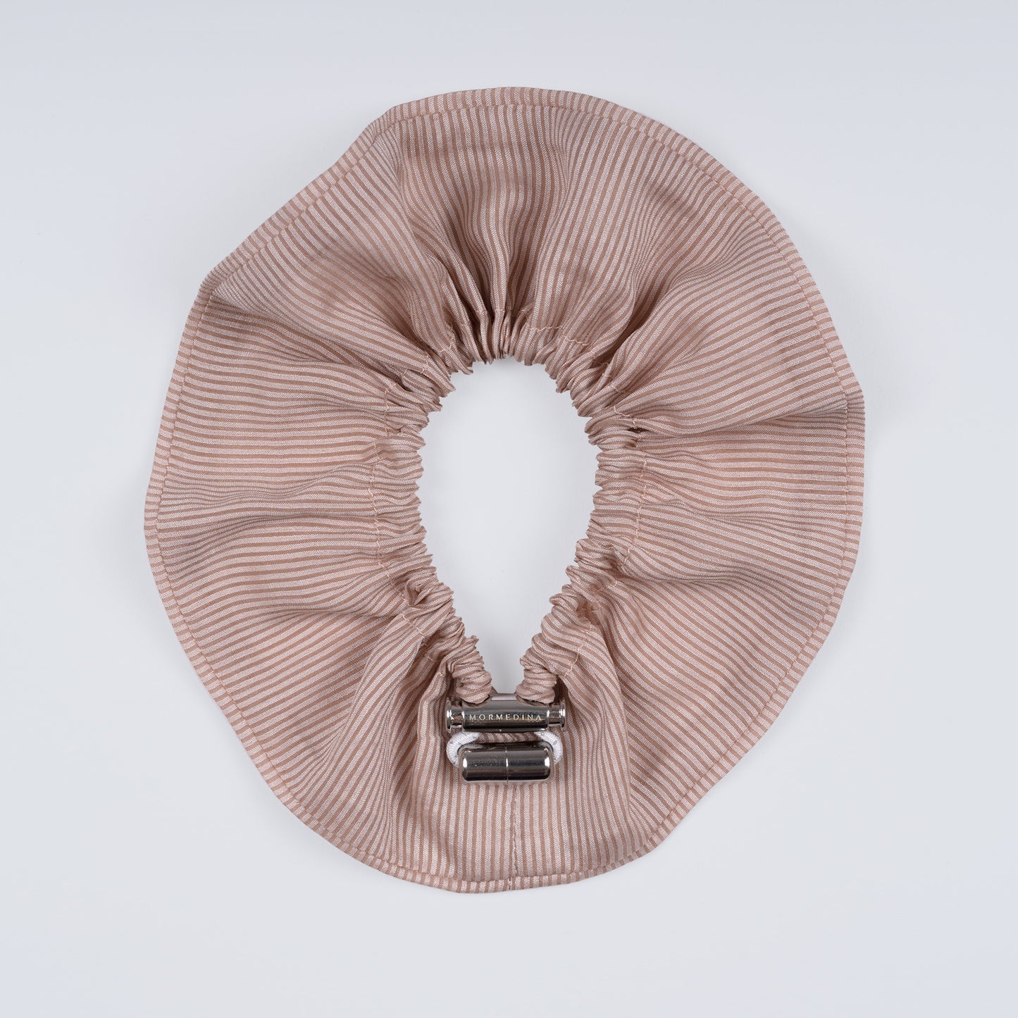 Striped scrunchie opened fully to reveal flexible elastic and elegant cotton texture.