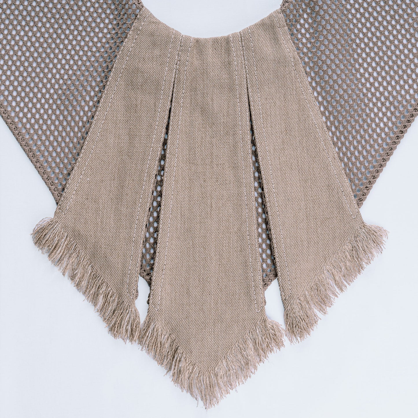 Close-up of sand-colored canvas and mesh fabric