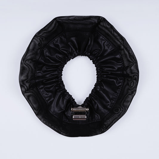 Black adjustable scrunchie opened fully, highlighting the contrast between durable ripstop nylon and soft mesh fabric.