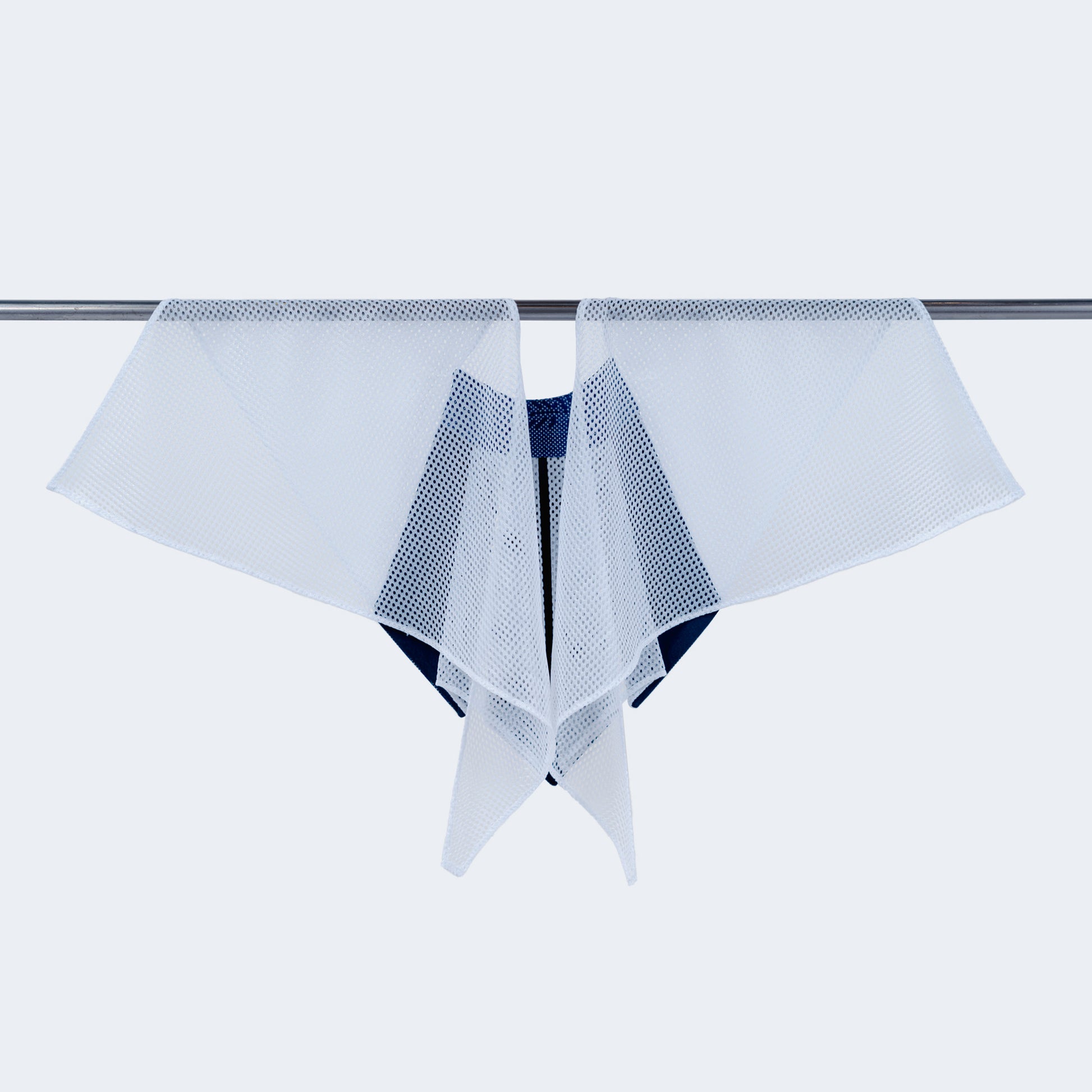 Back view showing sheer white mesh on hanger