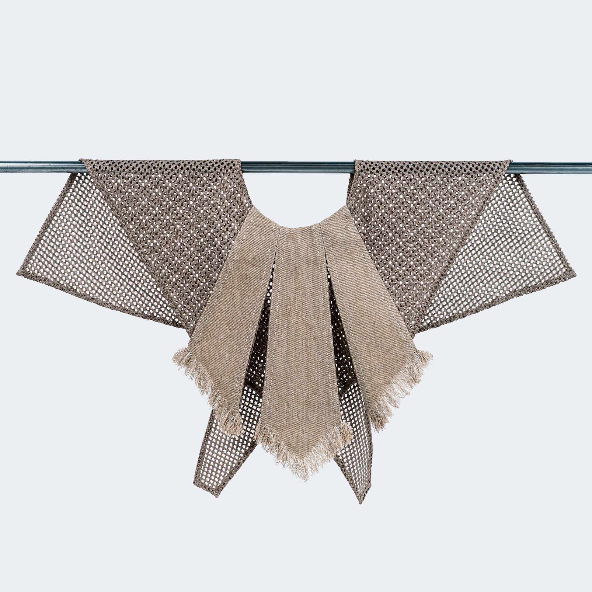 Front view of sand-colored canvas and mesh collar on hanger