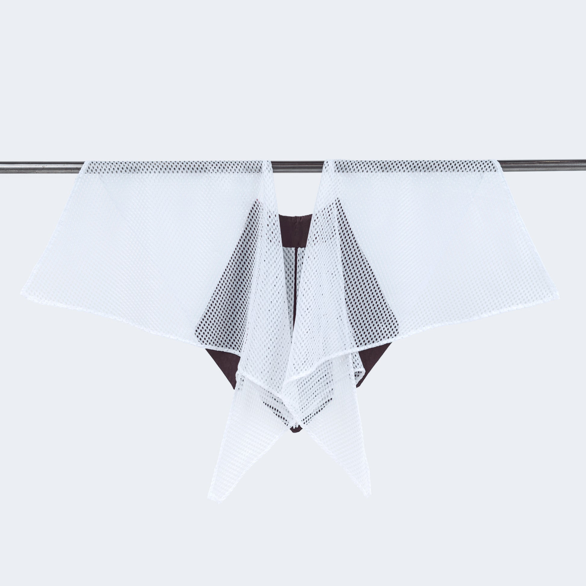 Back view of floral print collar with sheer white mesh, displayed on hanger