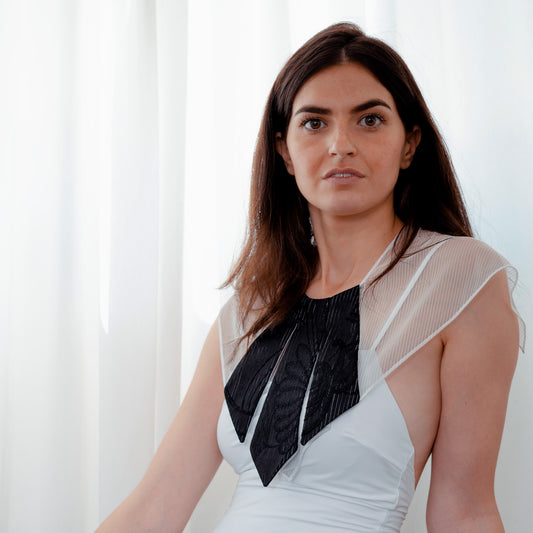 Model close-up wearing floral and striped silk collar with mesh