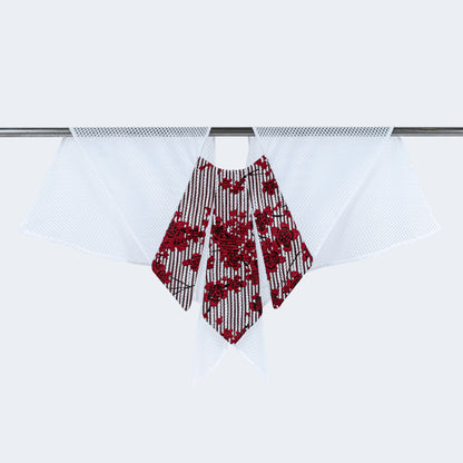 Front view of floral print collar with sheer white mesh, displayed on hanger