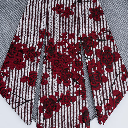 Detailed close-up of floral print collar with sheer gray mesh fabric