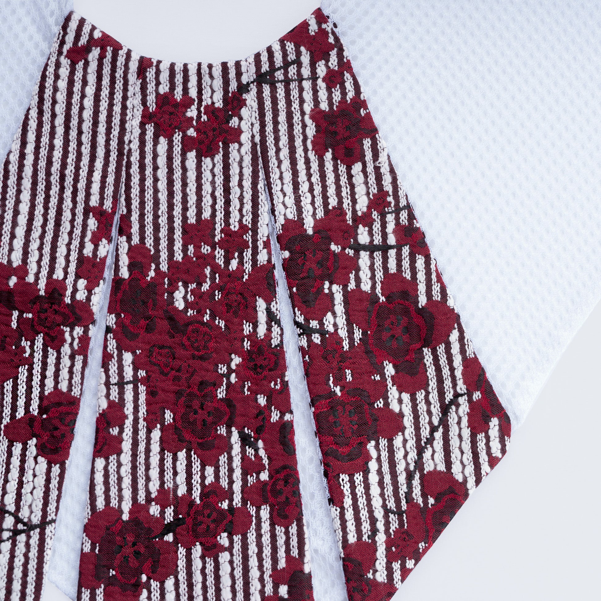Close-up of floral print collar with sheer white mesh fabric
