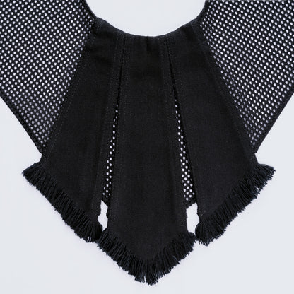Close-up of black denim and sheer mesh fabrics