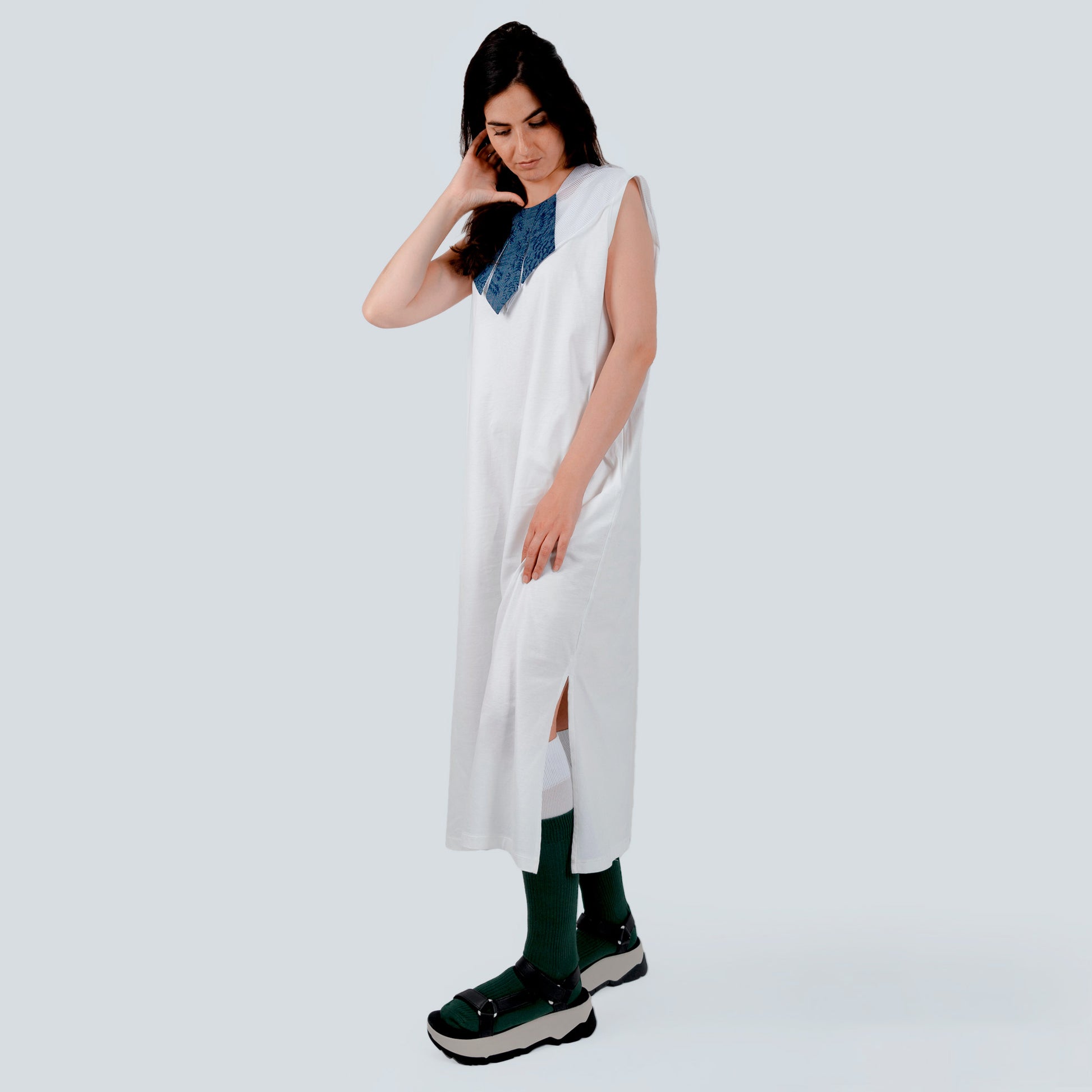 Model wearing silk collar over white dress