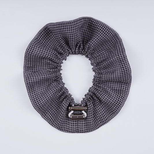 Gray squares scrunchie opened fully to show the flexible elastic and structured design.