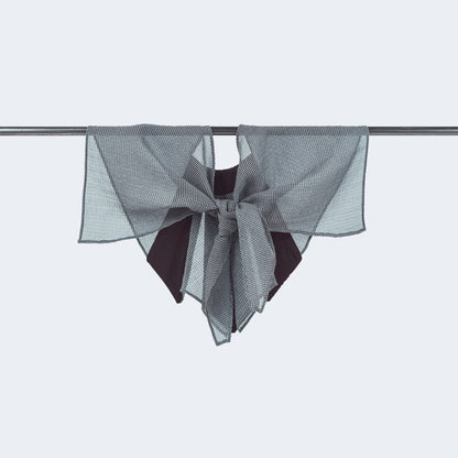 Back view of floral print and sheer gray mesh collar tied, displayed on hanger