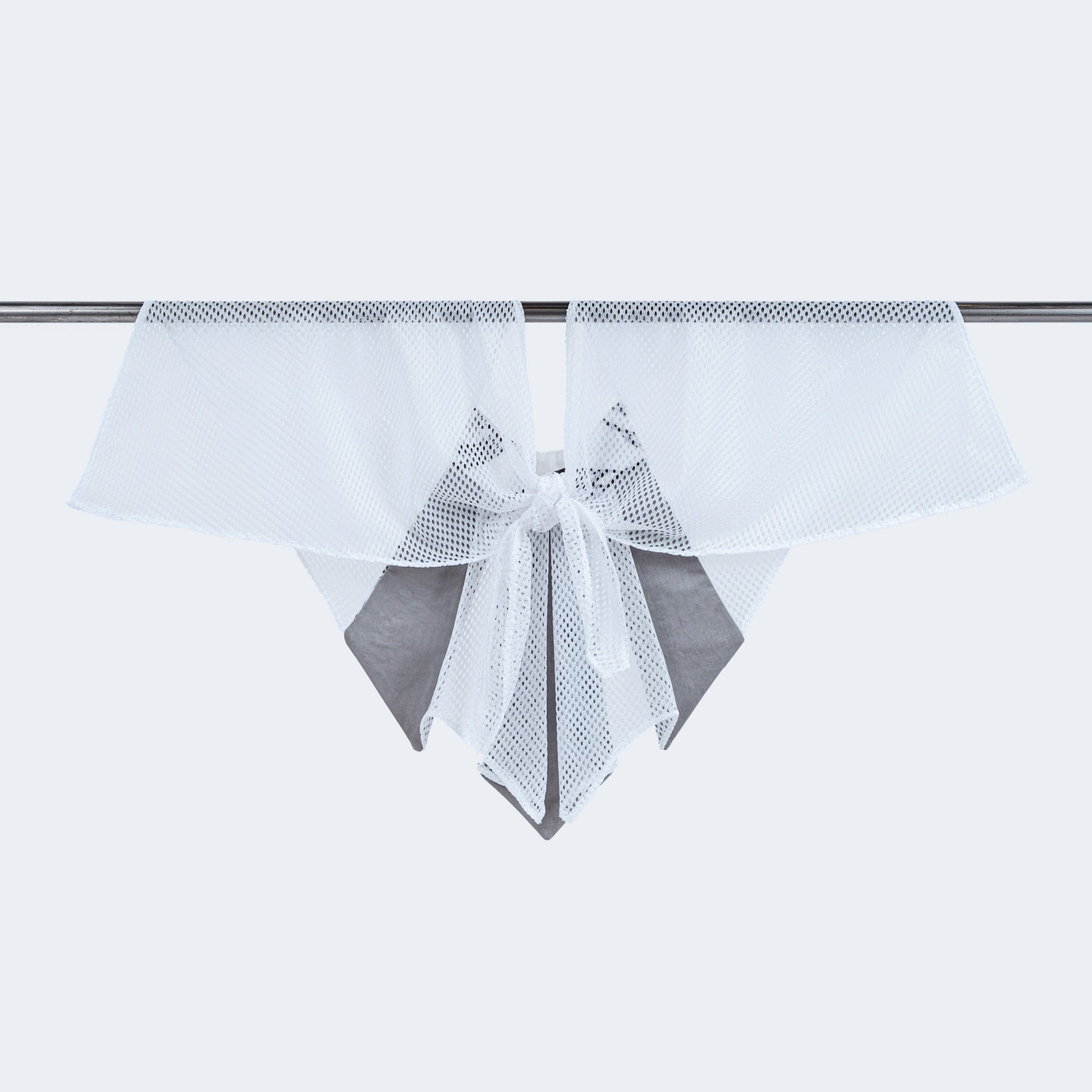 Back view of Japanese print and sheer white mesh collar tied, displayed on hanger