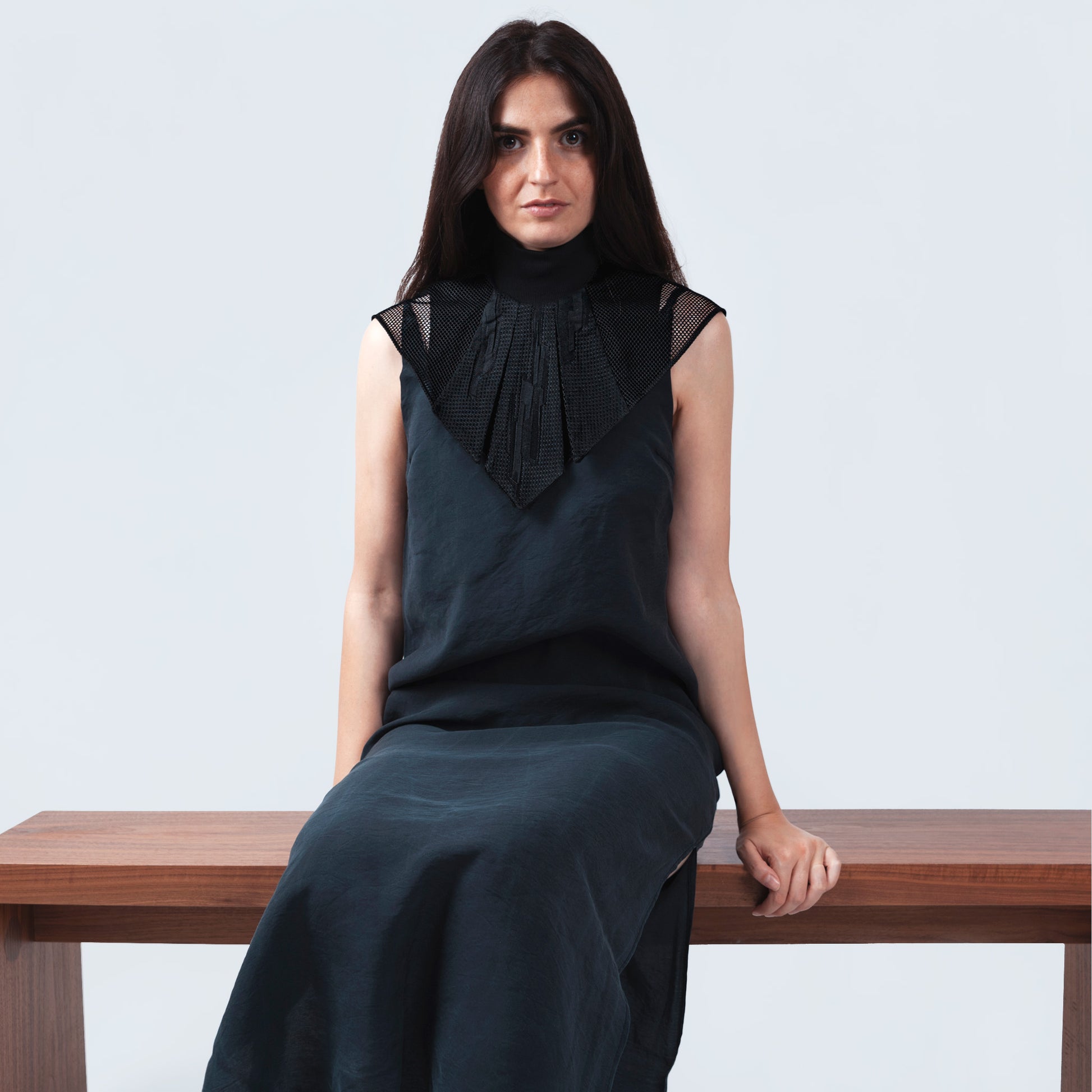 Model showcasing collar with Japanese geometric black silk and sheer black mesh