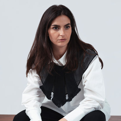 Close-up of model wearing black collar – texture detail